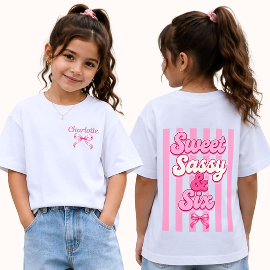 Personalised Sweet Sassy and Six Birthday T-Shirt with custom name on the front, pink coquette bow and large Sweet Sassy & Six design on the back. 6th birthday shirt.