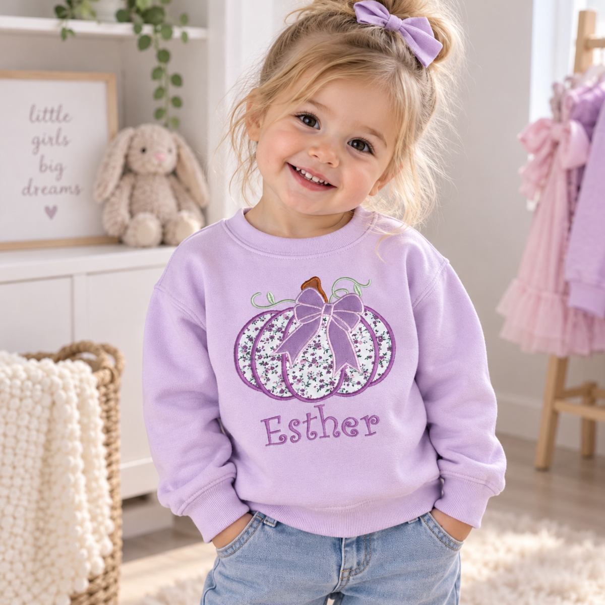 Personalised Halloween Sweatshirt for girls with embroidered floral pumpkin, purple bow and custom name, available in pink, lilac and white