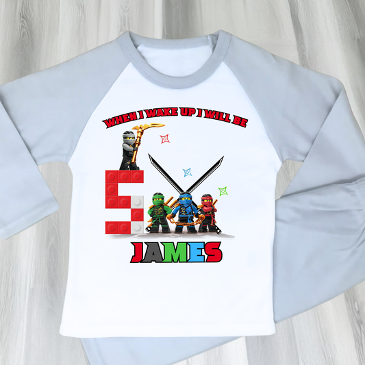 Personalised LEGO Ninja Birthday Pyjamas with child’s name and age, featuring a colourful superhero design for boys and girls aged 2–7.