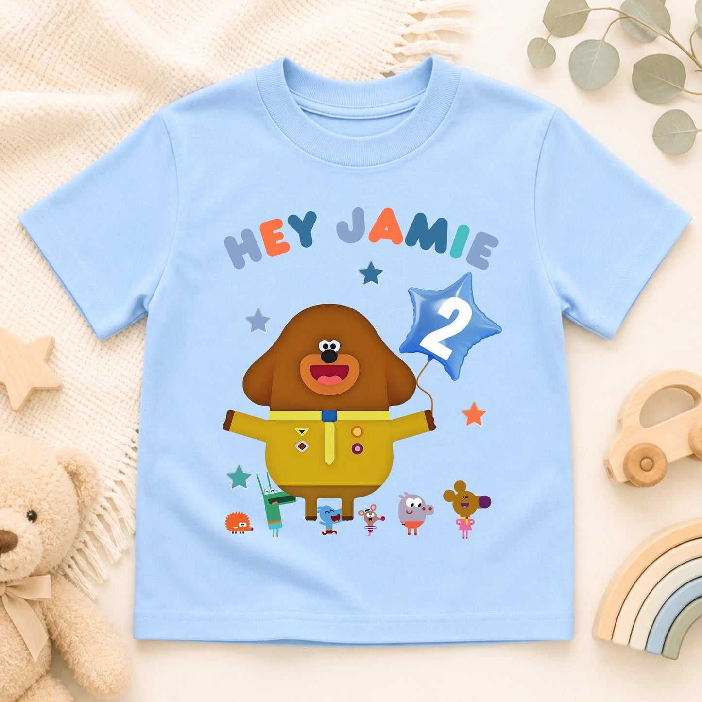 A personalised Hey Duggee kids birthday t-shirt featuring a colourful character design and the text "HEY Jamie" on the front.