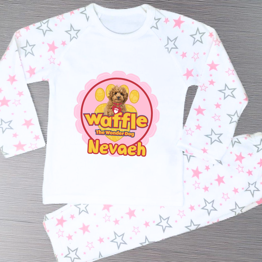 Personalised Waffle Pyjamas: Children's long-sleeve pyjamas with personalised Waffle the Wonder Dog design on a star-patterned background, custom name pyjamas