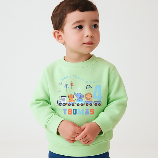 Safari birthday sweatshirt, White cotton t-shirt featuring a vibrant safari jungle theme designed for a boy's birthday party. The top is personalised with the phrase ‘Choo Choo I'm Two,’ or any age, and adorned with playful illustrations of jungle animals like lions, elephants, and giraffes, perfect for a safari-themed celebration. Also for boys that love trains. Boys toddler birthday shirt, personalised toddler gift ideas, jungle animal themed birthday party ideas.