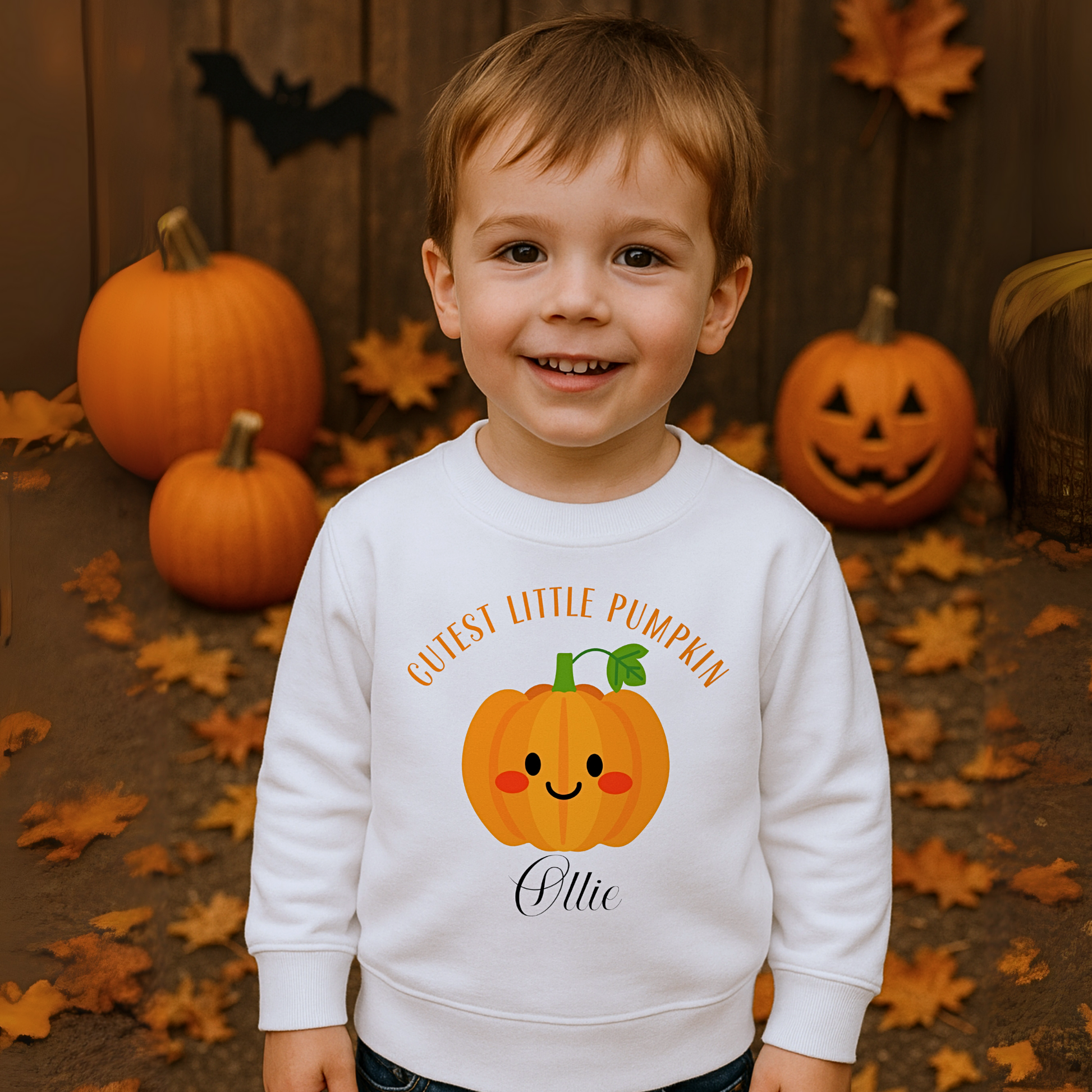 Personalised halloween sweatshirt: Toddler wearing a personalised Halloween pumpkin sweatshirt that says "Cutest Little Pumpkin", Personalised Halloween Jumper, Toddler pumpkin jumper