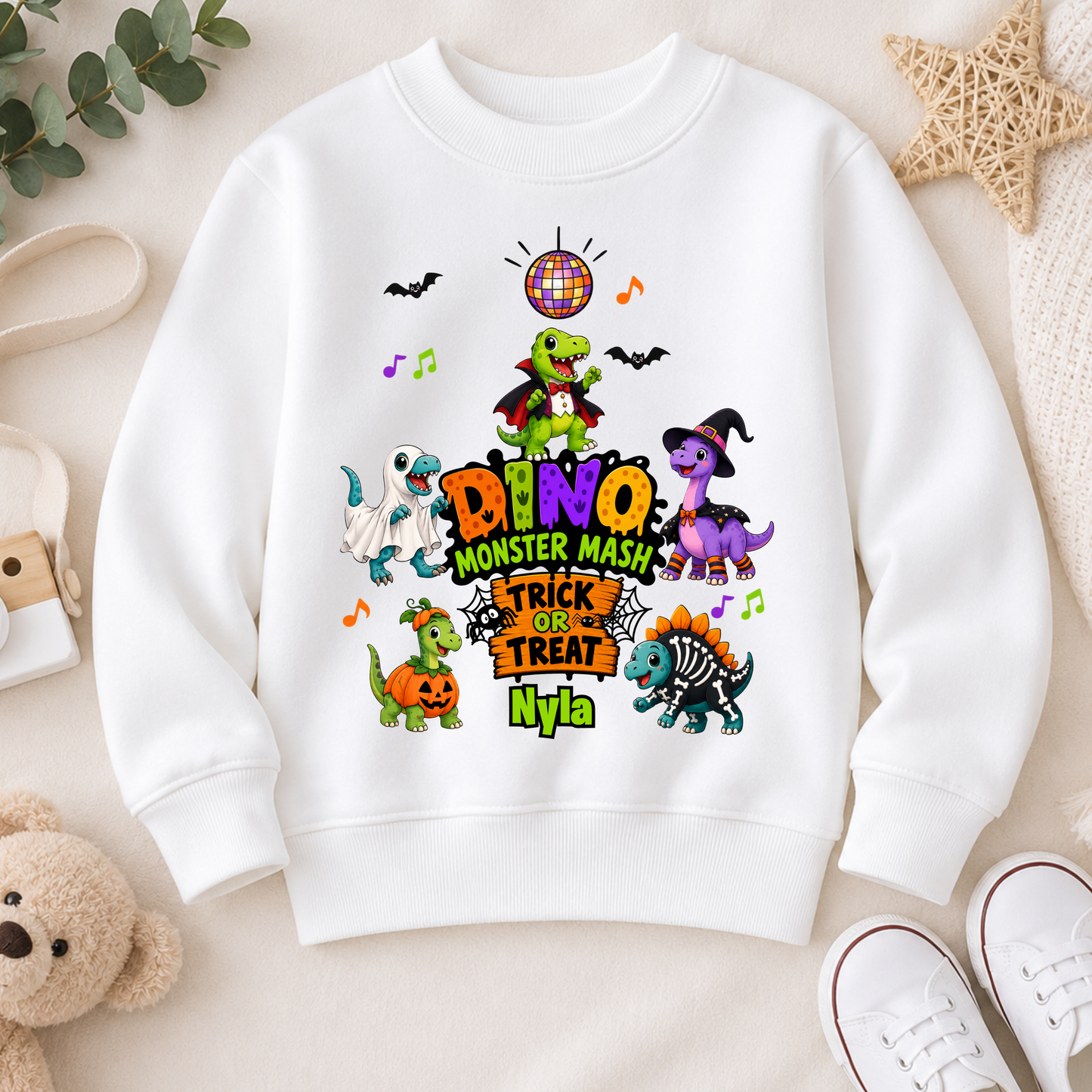 Personalised Halloween Sweatshirt for kids with name, colourful Dino Monster Mash dinosaurs, Trick or Treat design and cute Halloween characters.