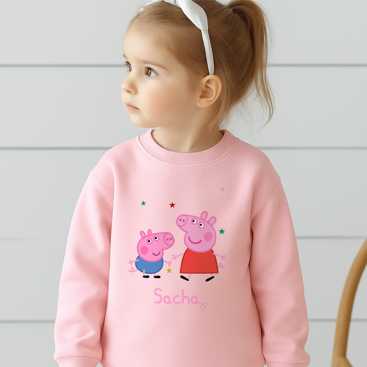 Personalised Peppa and George Sweatshirt: Child wearing a personalised Peppa and George Pig white sweatshirt with her custom name printed on it.