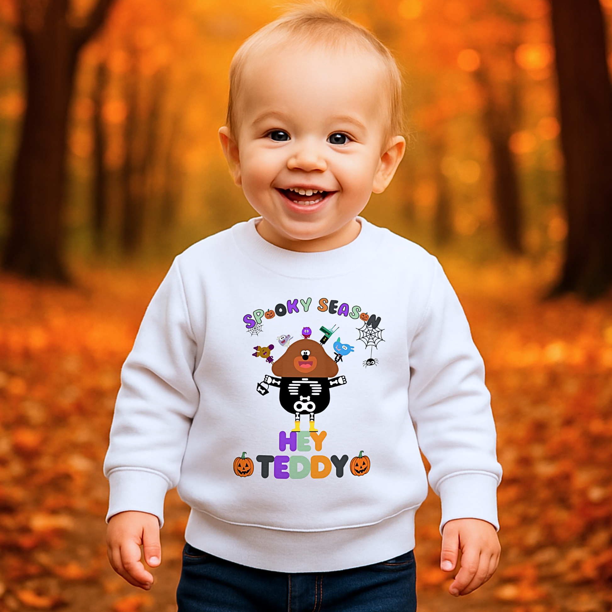 Child wearing personalised Halloween sweatshirt with trick-or-treat, Spooky Season design and custom name custom name