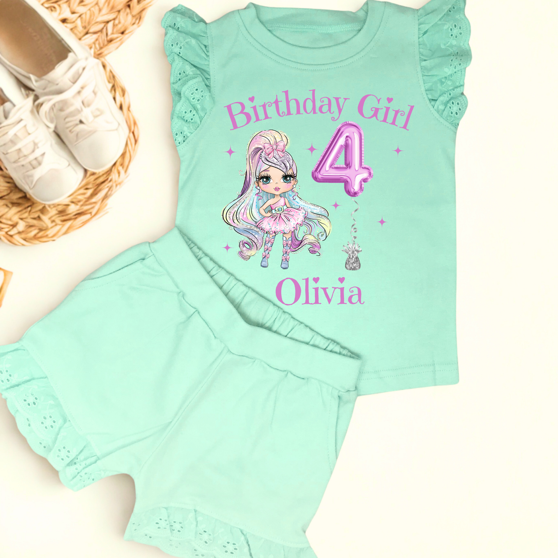 A vibrant and colourful personalised birthday outfit for girls, featuring a glitter-like design reminiscent of a pop star's ensemble. The set includes frilly shorts and a matching top, both adorned with rainbow hues, offering a playful and festive look. This personalised birthday girl outfit is perfect for a birthday celebration, capturing the spirit of fun and fashion. It also comes with a custom rainbow doll in the design, making it an ideal gift for young fashion enthusiasts.