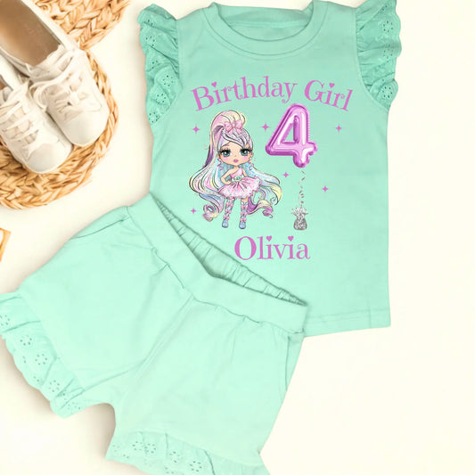 A vibrant and colourful personalised birthday outfit for girls, featuring a glitter-like design reminiscent of a pop star's ensemble. The set includes frilly shorts and a matching top, both adorned with rainbow hues, offering a playful and festive look. This personalised birthday girl outfit is perfect for a birthday celebration, capturing the spirit of fun and fashion. It also comes with a custom rainbow doll in the design, making it an ideal gift for young fashion enthusiasts.