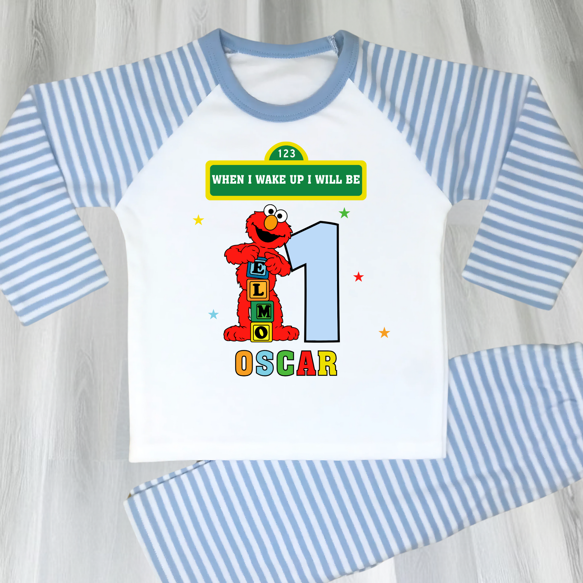 Elmo birthday pyjamas for boys with custom name and age, featuring Elmo from Sesame Street with bright birthday number, name printed underneath, soft and comfy pyjama set perfect for birthday morning celebrations