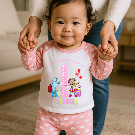 Child wearing a pink and white In the night garden birthday pyjamas, when i wake up in the night garden, iggle piggle pajamas, upsy daisy pajamas birthday