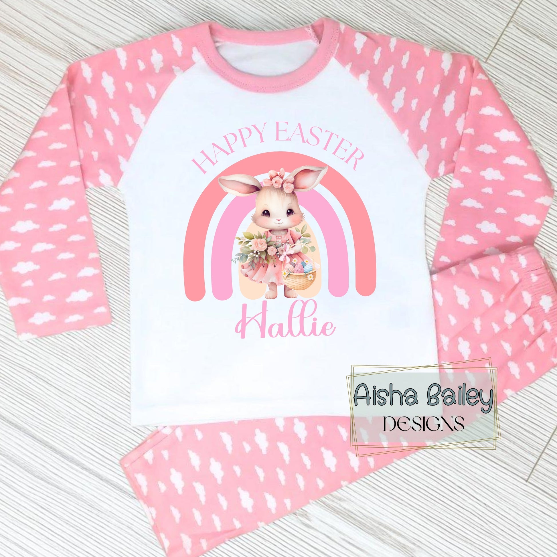 Personalised Easter Pyjamas for girls with their custom name. Bunny Rainbow design in soft pink pastel tones