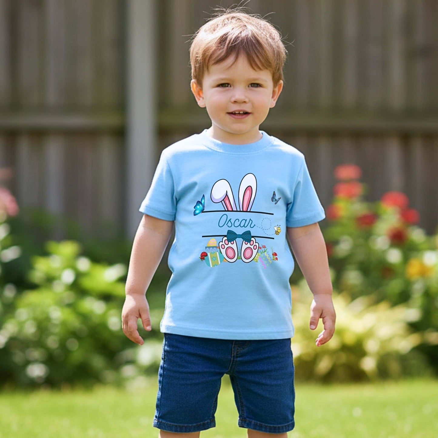 Boys Easter top with personalised split monogram bunny design, available as t-shirt or sweatshirt. Custom name Easter top