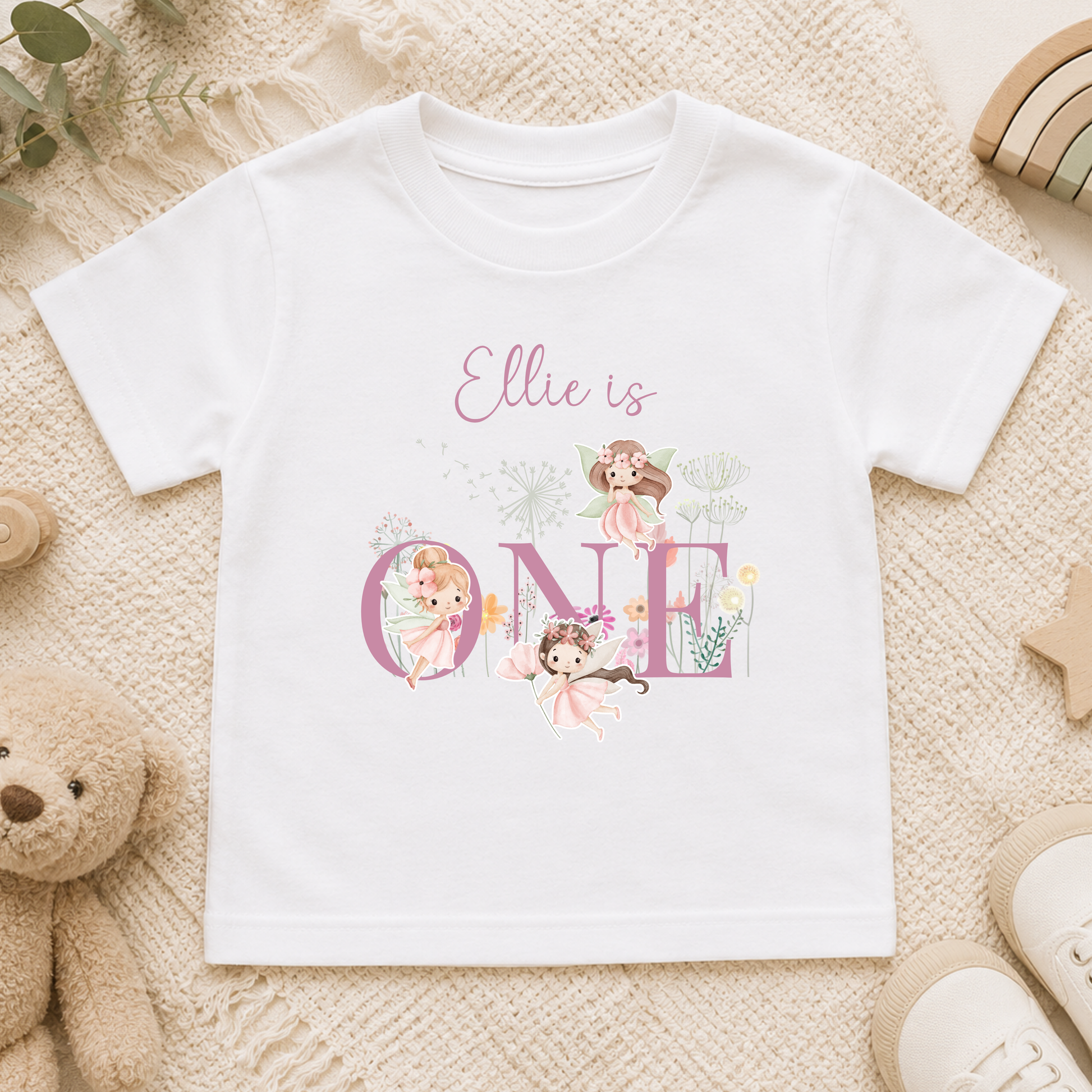 Personalised fairy birthday outfit for girls featuring custom name, chosen age, fairy garden artwork and floral design, perfect for birthday celebrations and photoshoots.