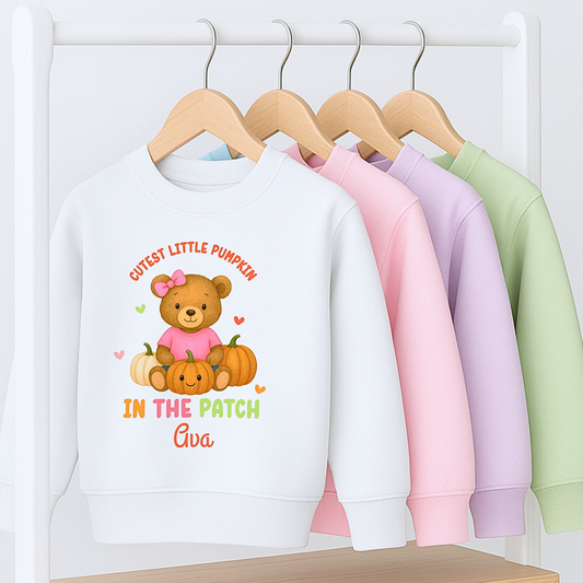 Personalised Halloween sweatshirt for kids with teddy bear and “Cutest Pumpkin in the Patch” design.
