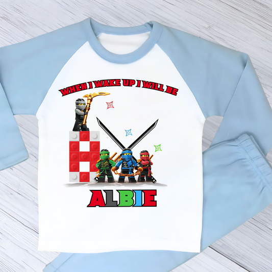 Personalised LEGO Ninja Birthday Pyjamas with child’s name and age, featuring a colourful superhero design for boys and girls aged 2–7.
