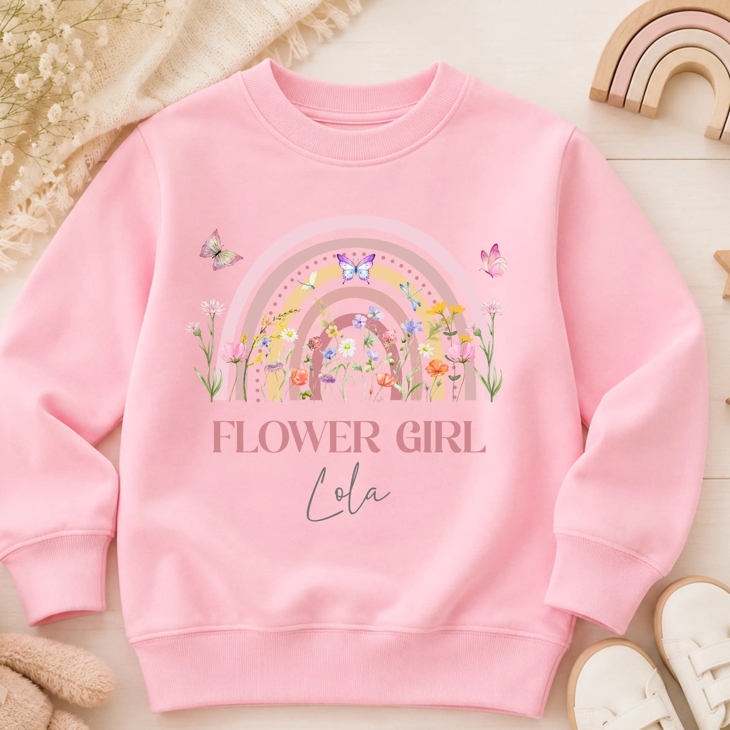 Personalised flower girl T-Shirt or sweatshirt with boho rainbow floral design, butterflies, custom name, and wedding role for children’s wedding outfits.