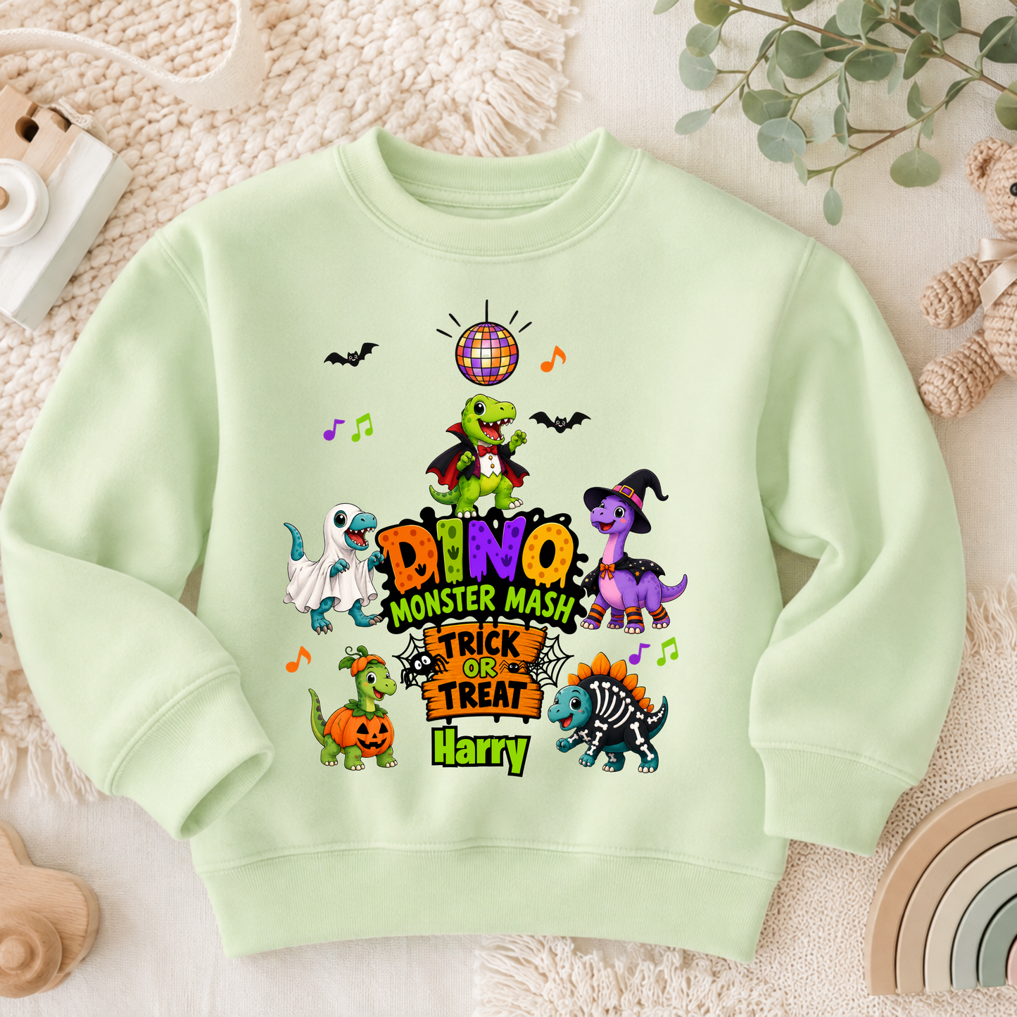 Personalised Halloween Sweatshirt for kids with name, colourful Dino Monster Mash dinosaurs, Trick or Treat design and cute Halloween characters.