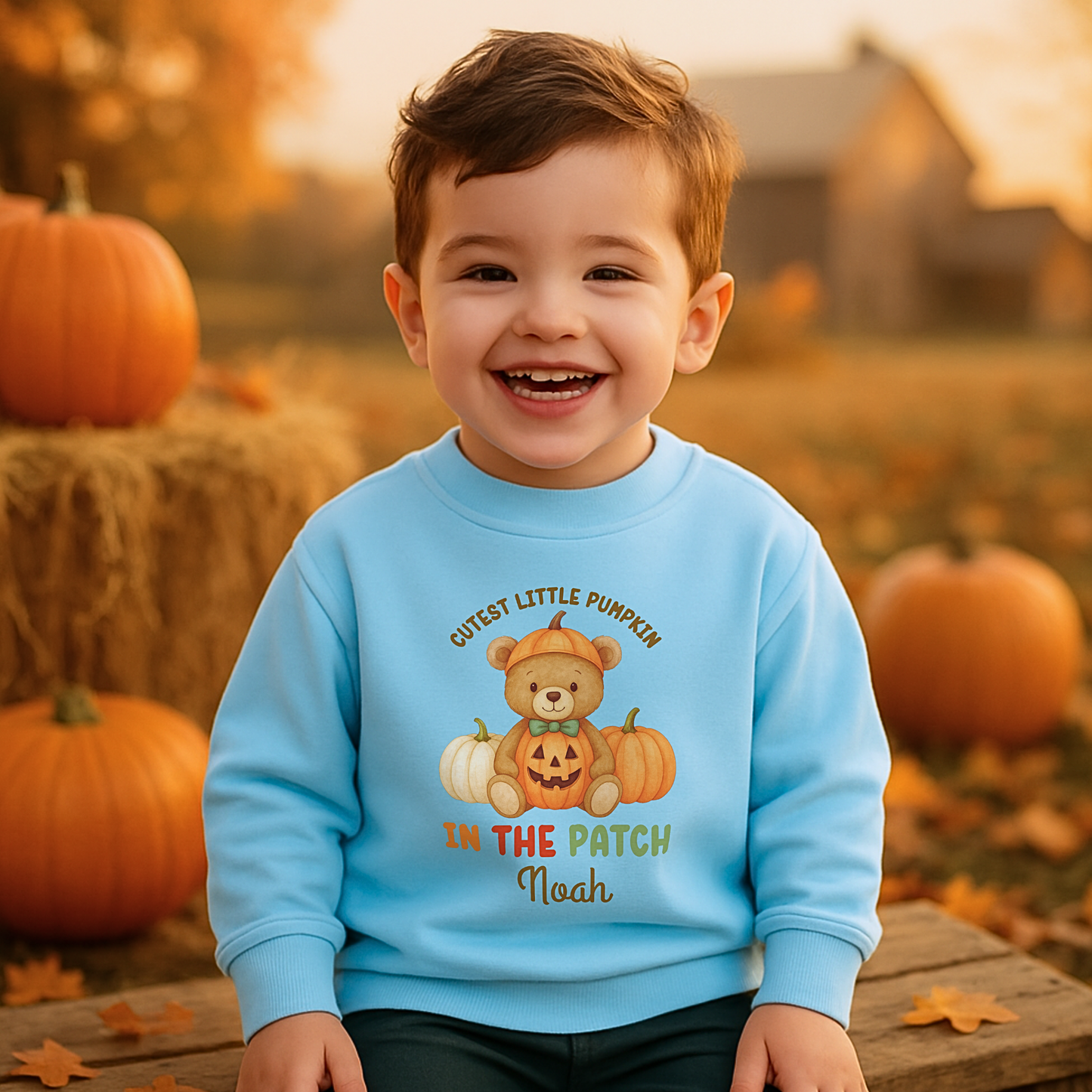 Personalised Halloween sweatshirt for kids with teddy bear and “Cutest Pumpkin in the Patch” design.