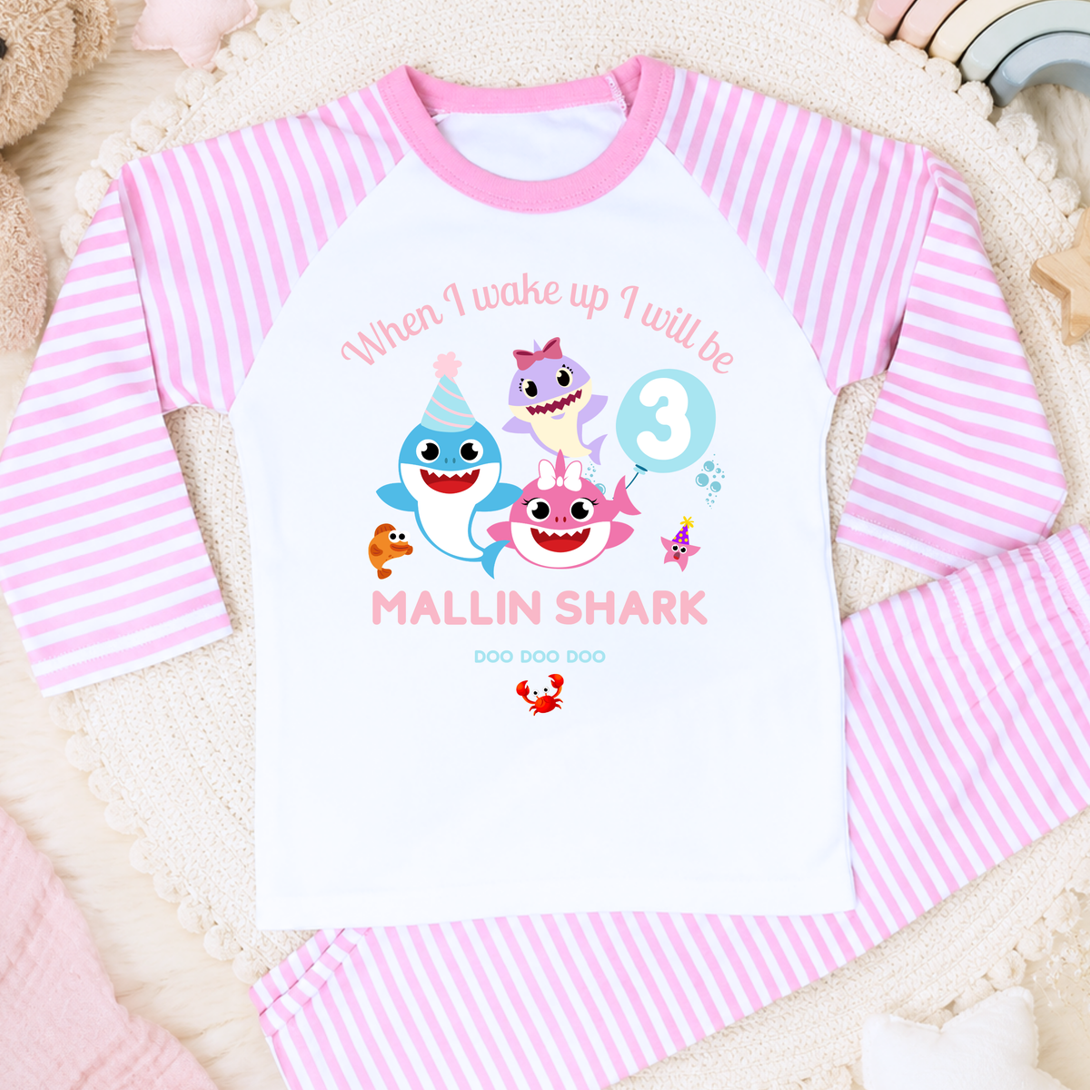 Personalised Baby Shark Birthday Pyjamas for Girls, white long sleeve PJs with pink and blue shark design, birthday age and custom name