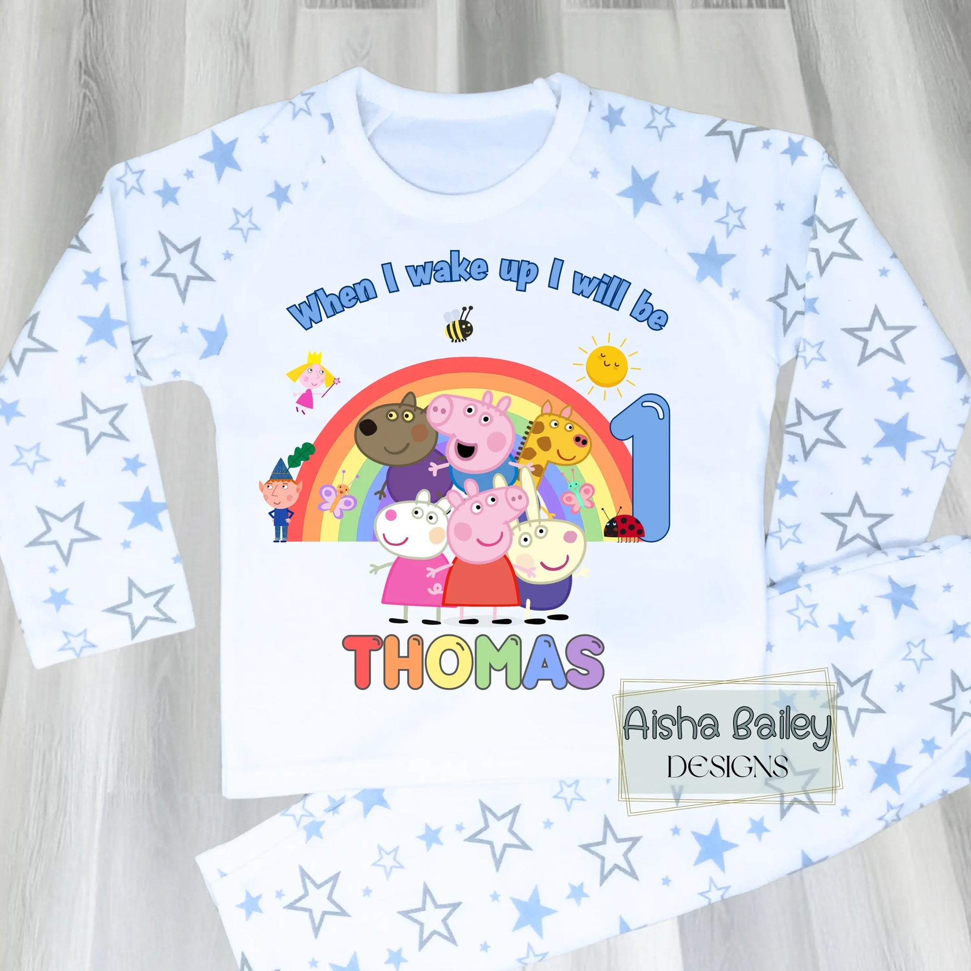 Blue Peppa Pig and friends personalised girls birthday pyjamas featuring a rainbow design and the text “When I wake up I will be with custom age and name, printed on a soft long-sleeve top and matching pink bottoms. Perfect personalised Peppa Pig birthday outfit for toddlers, ideal for first second third birthday celebrations, gifts, and bedtime photos.