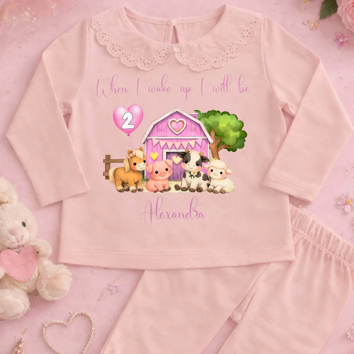 Farm Animal Birthday Pyjamas: Child wearing a white outfit with a Farm Animal Birthday Pyjamas for girls with personalised name, age balloon, cute farm animals, frilly collar and leg cuffs