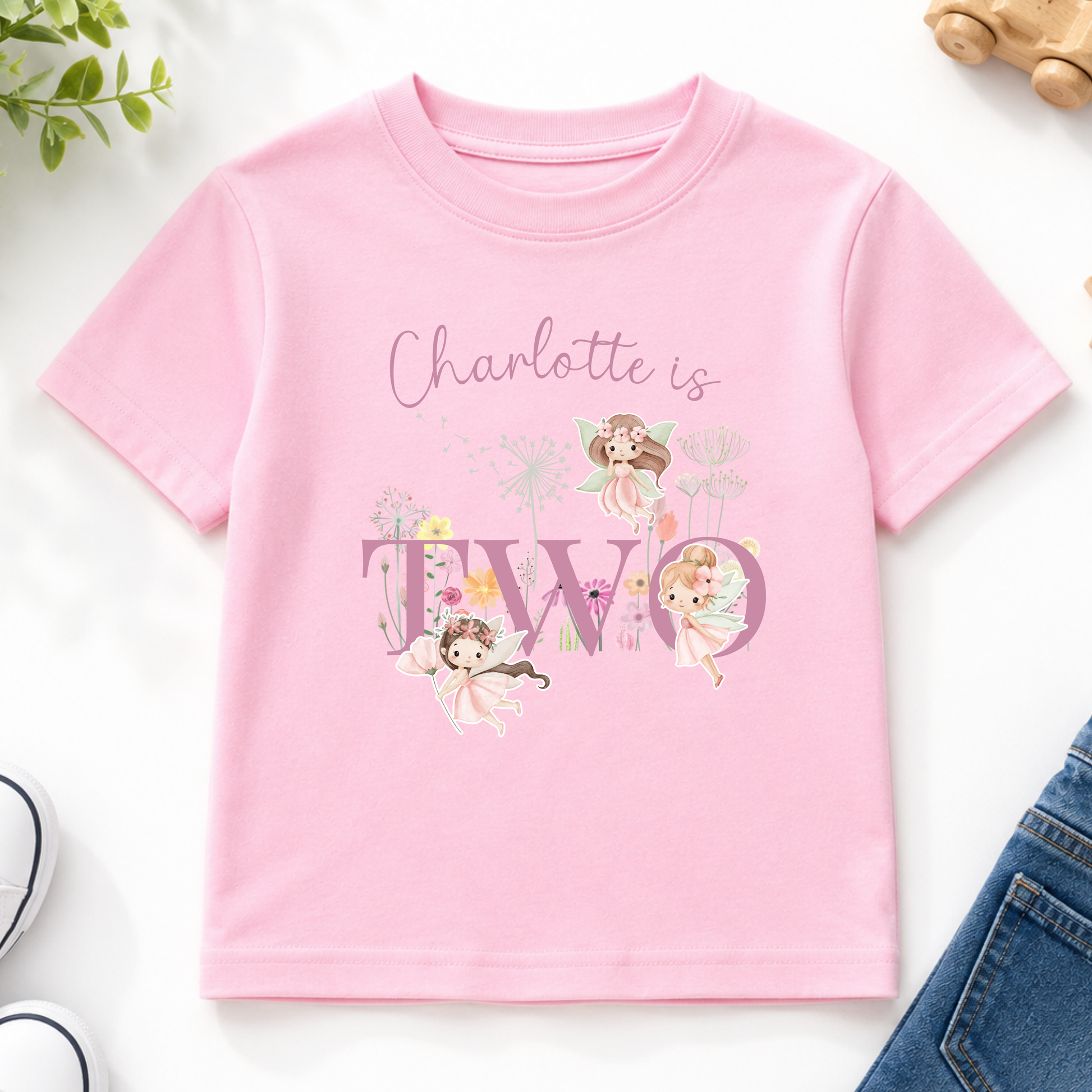 Personalised fairy birthday outfit for girls featuring custom name, chosen age, fairy garden artwork and floral design, perfect for birthday celebrations and photoshoots.