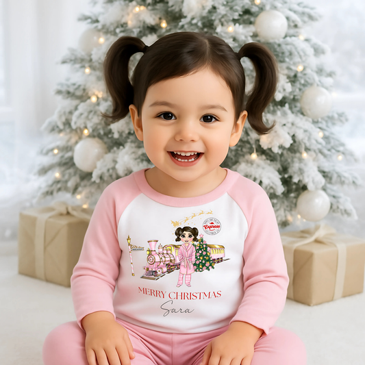 Polar Express Christmas Pyjamas: A set of Polar Express Christmas pyjamas for children, featuring a festive design with a Christmas train and the message "Merry Christmas." The pyjamas are customizable, allowing for personalization of the doll's hair color, skin tone, and eye color to reflect the child's unique features, creating a special, memorable keepsake. 