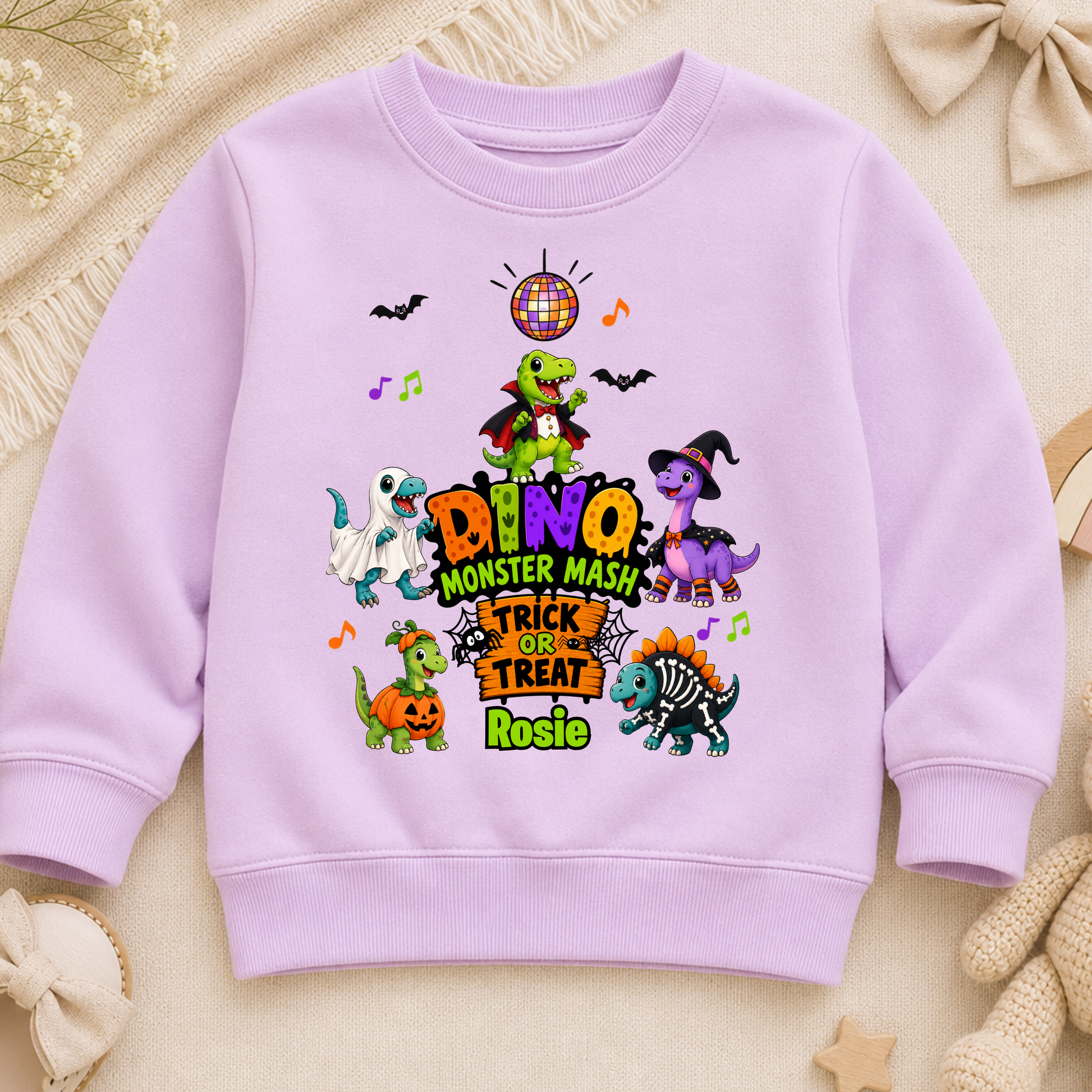 Personalised Halloween Sweatshirt for kids with name, colourful Dino Monster Mash dinosaurs, Trick or Treat design and cute Halloween characters.