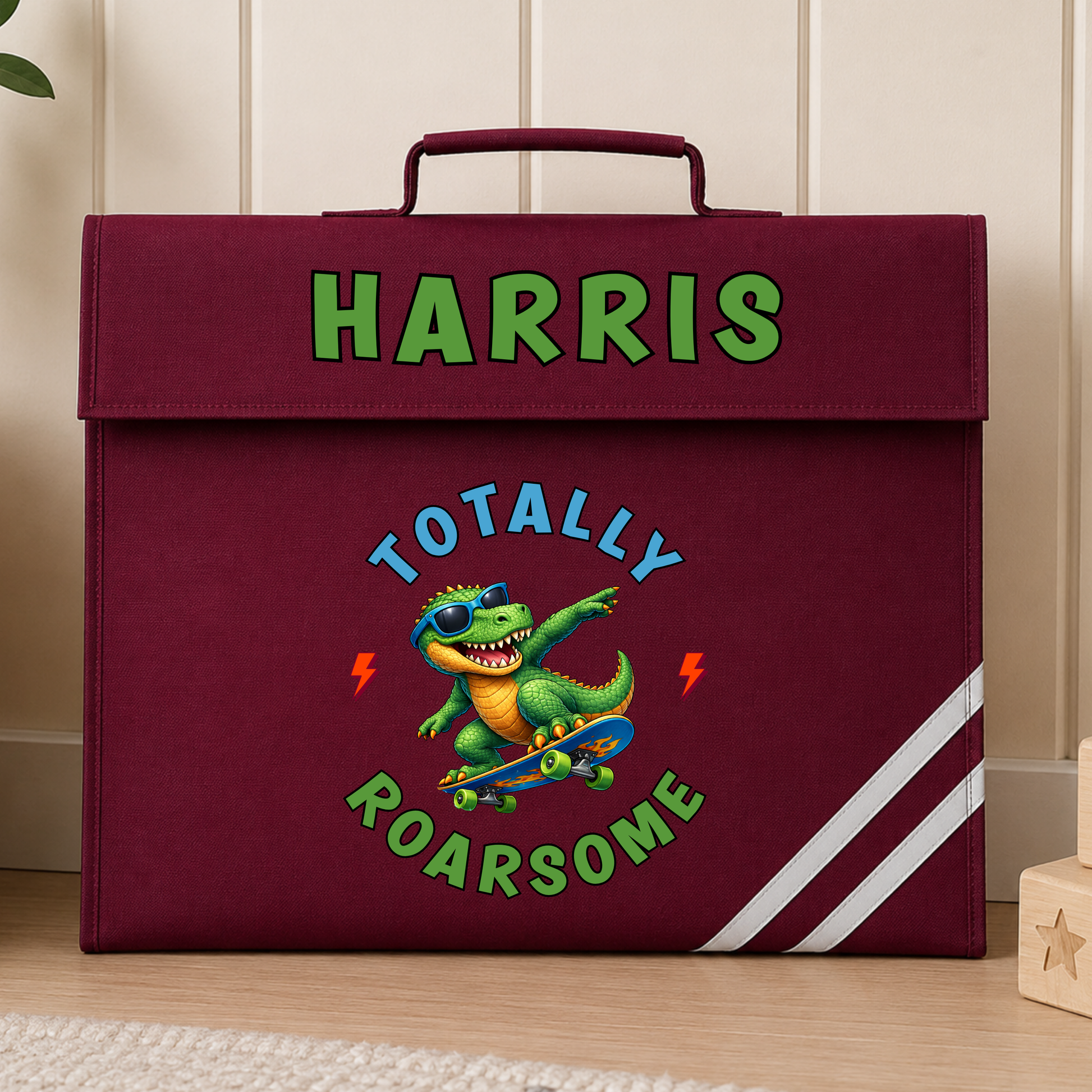 Personalised Back to School Book Bag, Boys School Book Bag with name and colourful skateboarding dinosaur design, available in green, navy, royal blue and burgundy.
