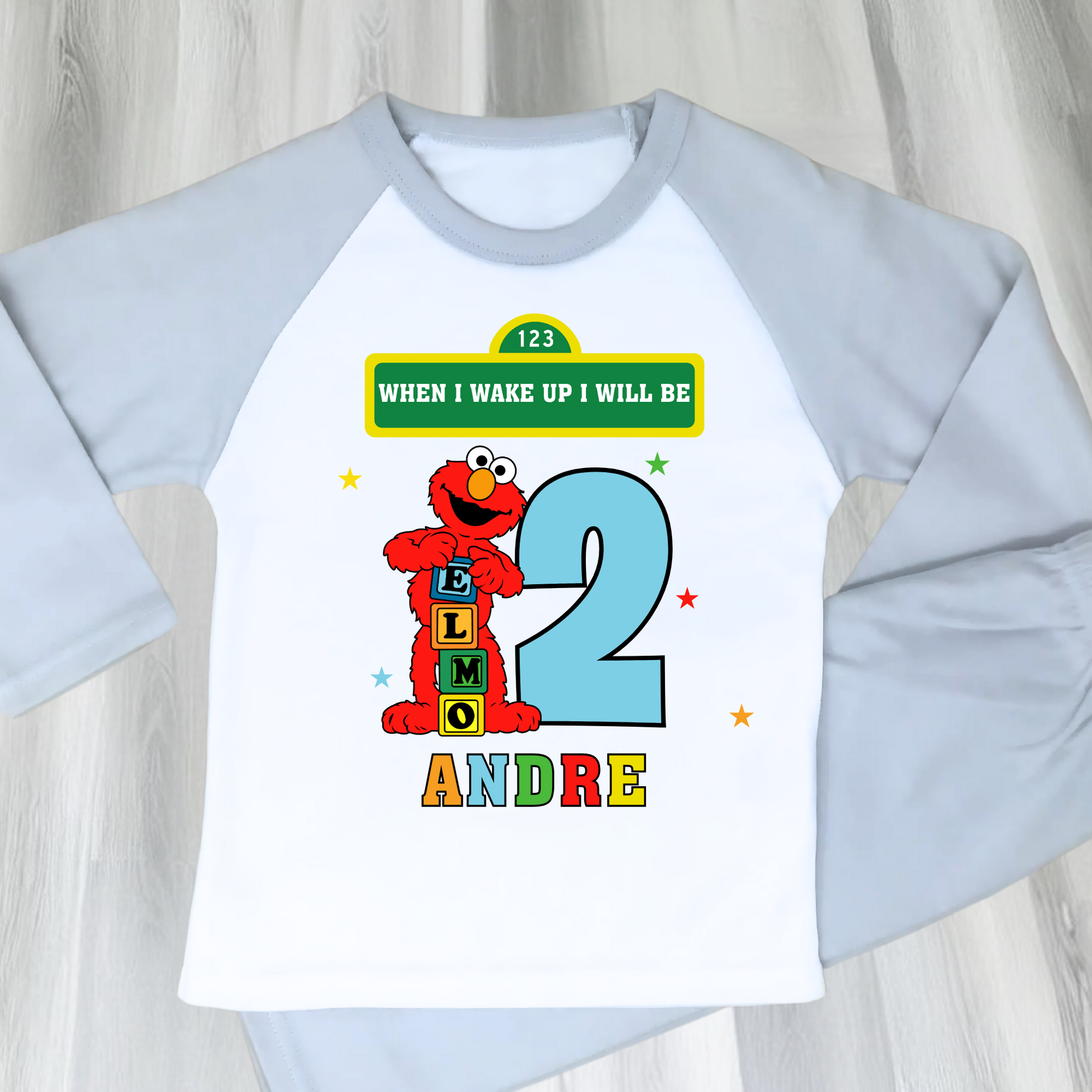 Elmo birthday pyjamas for boys with custom name and age, featuring Elmo from Sesame Street with bright birthday number, name printed underneath, soft and comfy pyjama set perfect for birthday morning celebrations