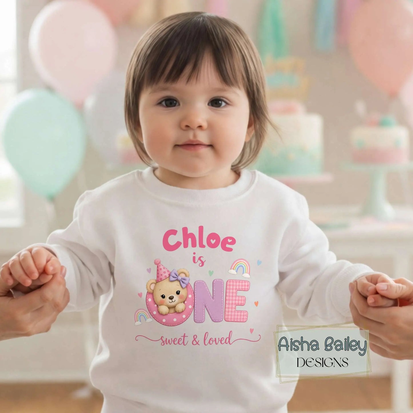 1st Birthday Sweatshirt, Personalised first birthday sweatshirt with custom name, pastel teddy design, baby wearing cosy birthday jumper at celebration