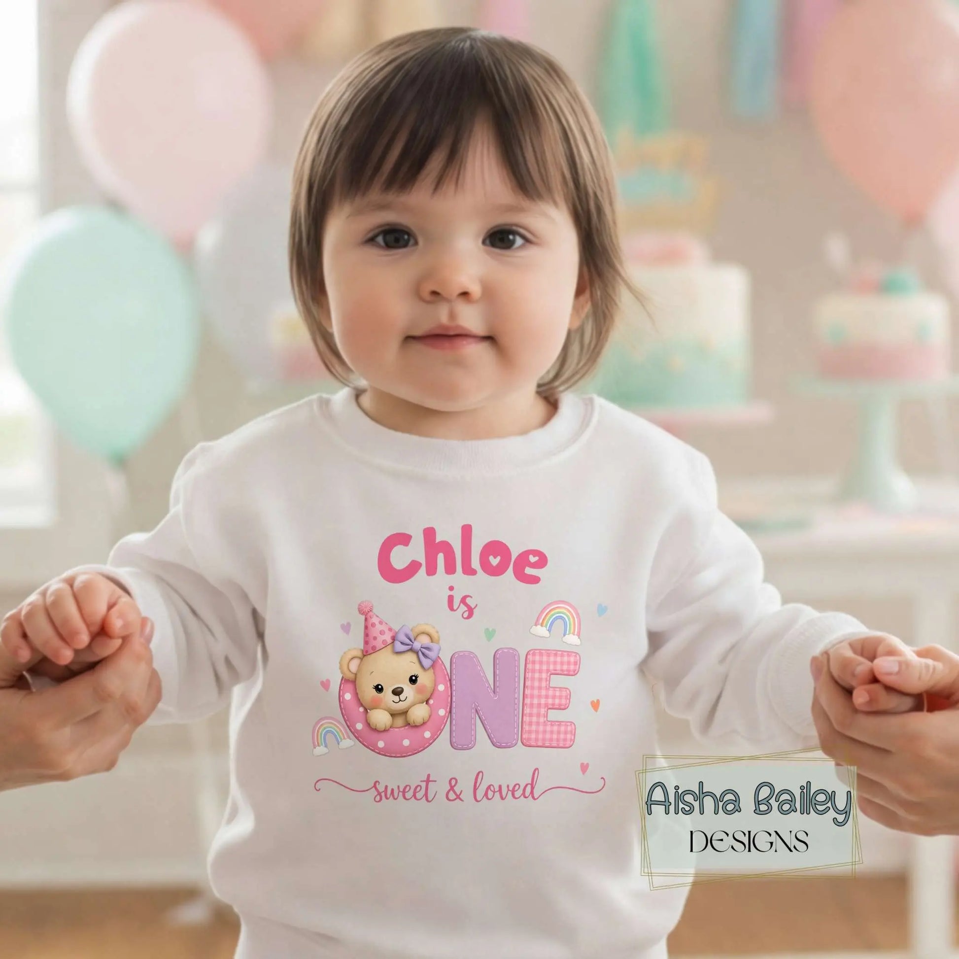 1st Birthday Sweatshirt, Personalised first birthday sweatshirt with custom name, pastel teddy design, baby wearing cosy birthday jumper at celebration