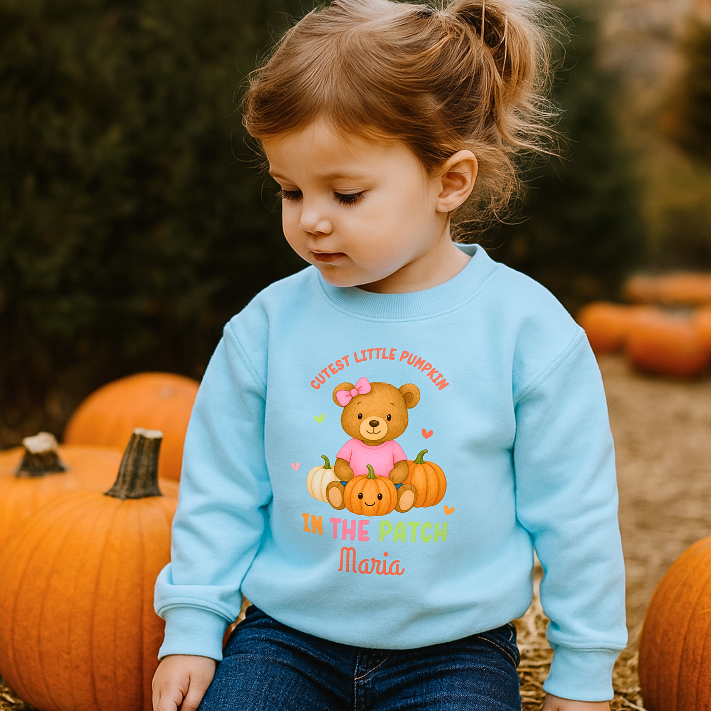 Personalised Halloween sweatshirt for kids with teddy bear and “Cutest Pumpkin in the Patch” design.
