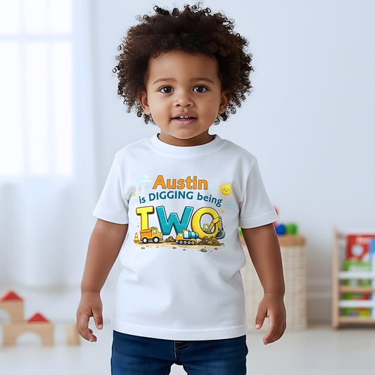 Digger birthday t-shirt personalised with child’s name and age, featuring colourful construction vehicles on a kids birthday shirt