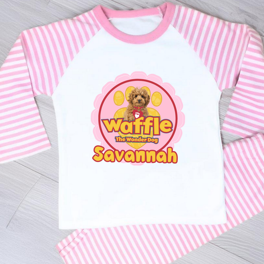 Personalised Waffle Pyjamas: Children's long-sleeve pyjamas with personalised Waffle the Wonder Dog design on a star-patterned background, custom name pyjamas