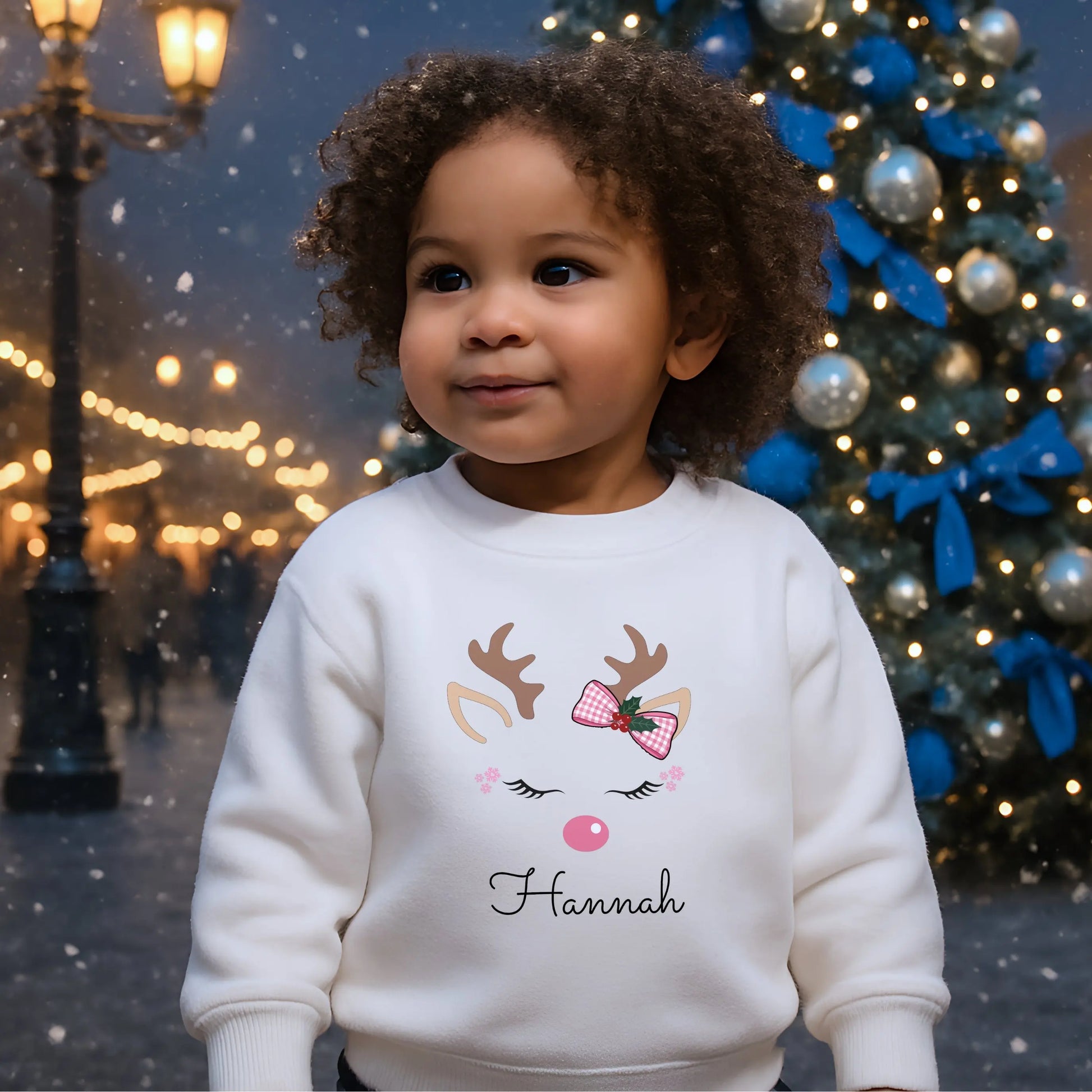 Girls Christmas Sweatshirt: Personalised Christmas sweatshirt for girls with pink reindeer design and custom name print.