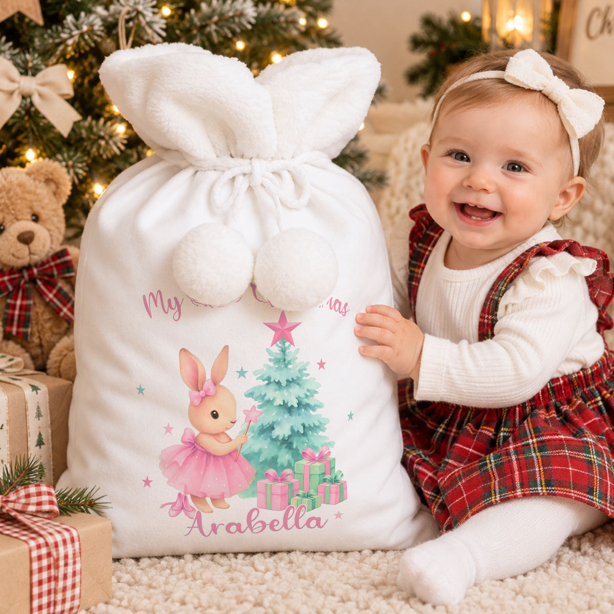 Personalised Christmas Sack and stocking for baby girl’s first Christmas, featuring a sweet bunny design and custom name for a magical Christmas keepsake.