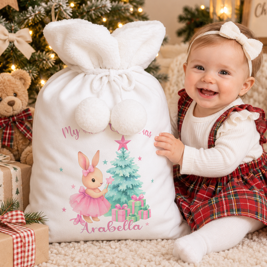 Personalised Christmas Sack and stocking for baby girl’s first Christmas, featuring a sweet bunny design and custom name for a magical Christmas keepsake.