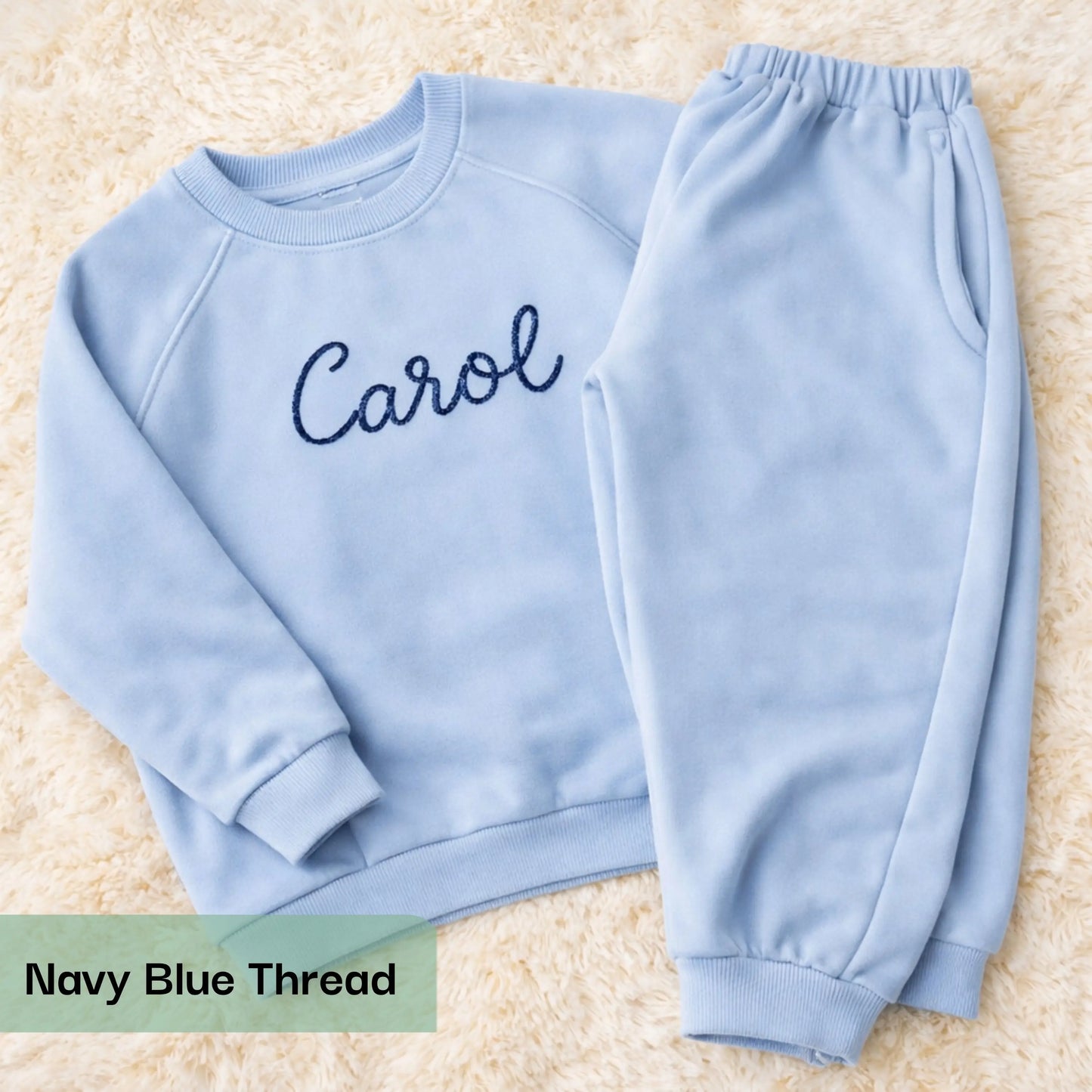 Personalised embroidered loungewear with a name: A child wearing a loungewear set with their name displayed on the front. Perfect for Christmas and birthday gifting