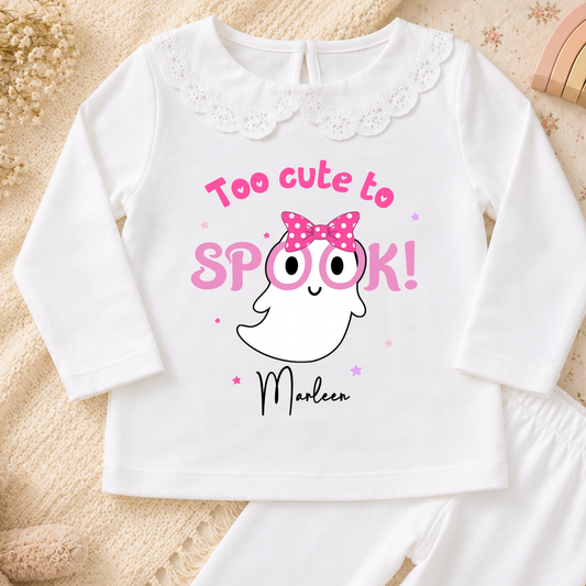 Personalised Halloween Pyjamas for Girls with cute pink ghost design, custom name, long sleeves and pretty frill details for spooky season.
