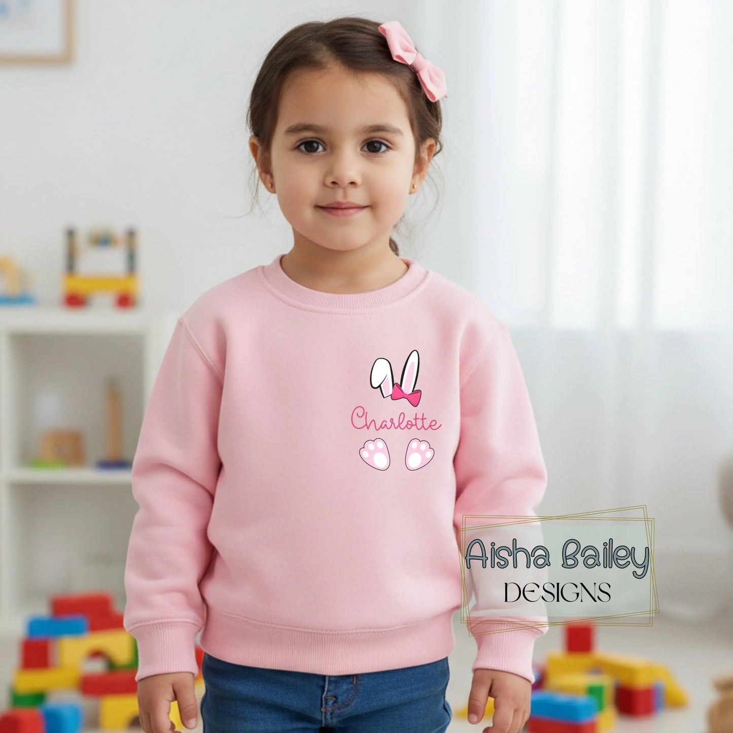 Personalised Easter top for girls with bunny ears design and custom name on left breast. Available in sweatshirt and t-shirt, Easter gift for kids