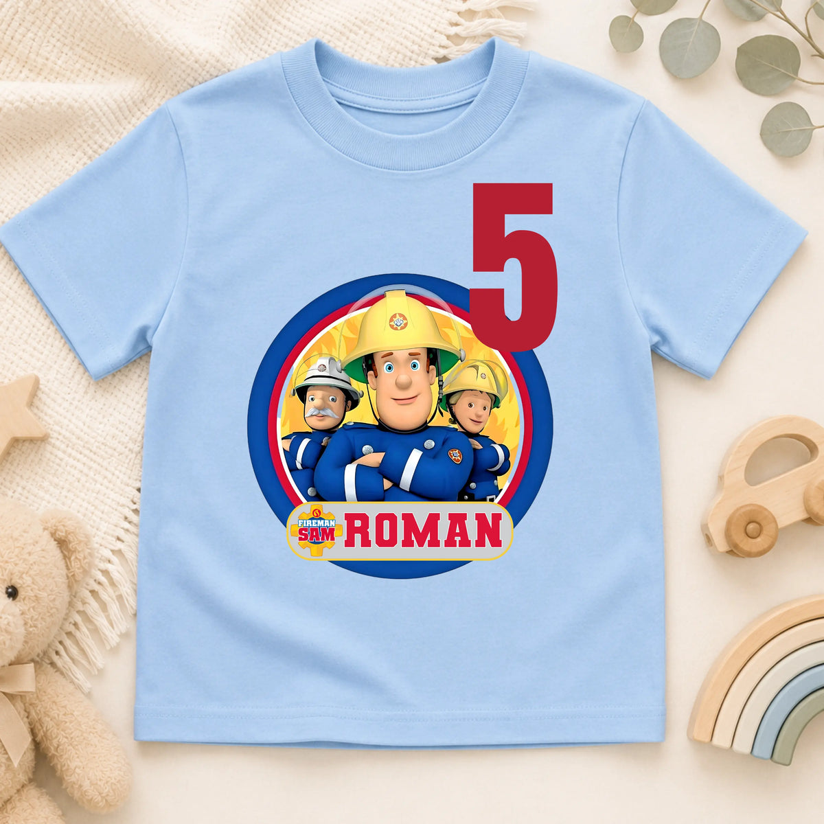 Personalised Fireman Sam birthday T-shirt for boys featuring a custom name and age with a colourful Fireman Sam-inspired design, perfect for birthday parties, cake smash photos and special celebrations.