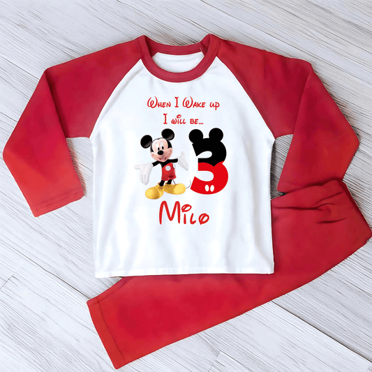 Personalised Mickie Birthday Pyjamas with mickie mouse inspired design, child's name and age, available in red or grey