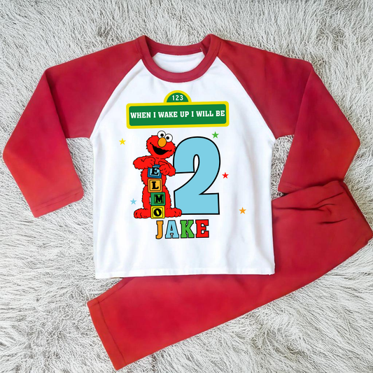Elmo birthday pyjamas for boys with custom name and age, featuring Elmo from Sesame Street with bright birthday number, name printed underneath, soft and comfy pyjama set perfect for birthday morning celebrations