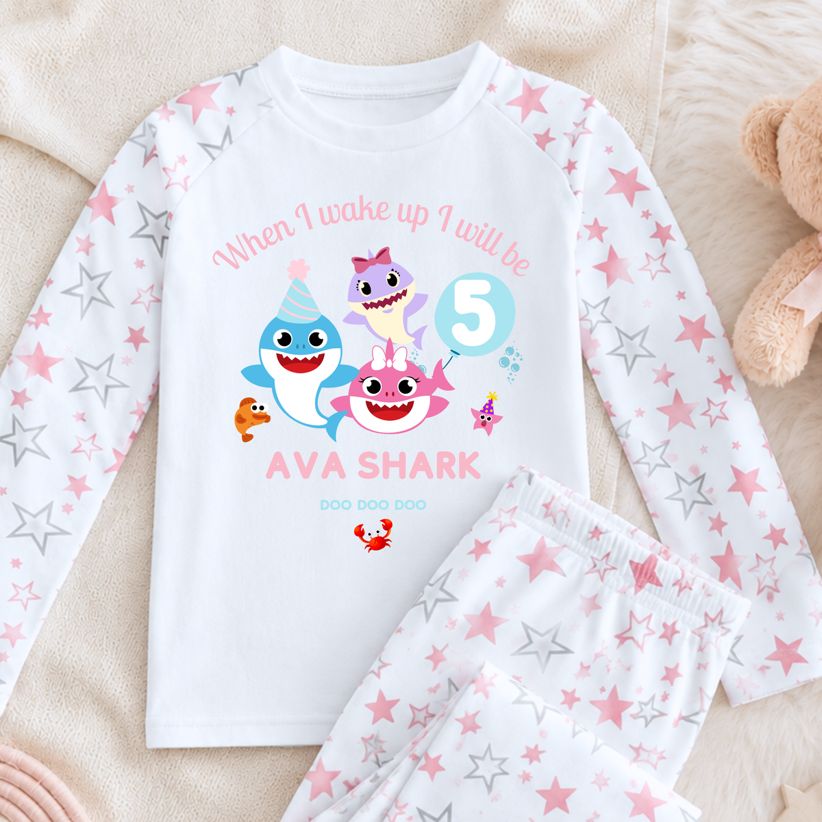 Personalised Baby Shark Birthday Pyjamas for Girls, white long sleeve PJs with pink and blue shark design, birthday age and custom name
