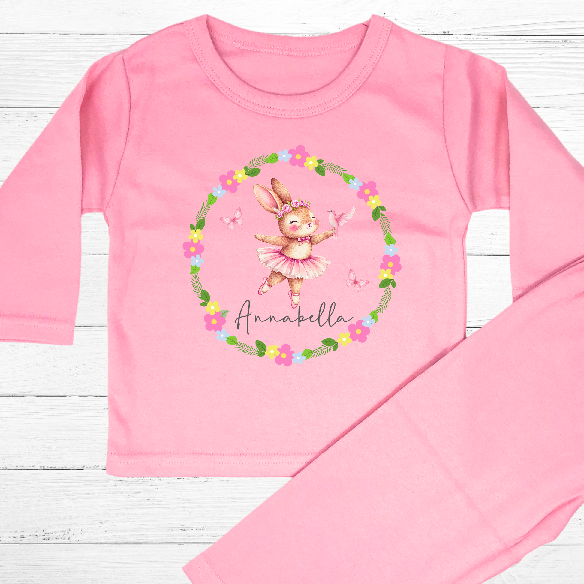 Personalised baby pyjamas: A set of personalised baby girl clothes featuring a dusky pink ballet bunny surrounded by a floral wreath. The pyjamas are designed for ages 0-2 years and includes flower-themed pyjamas. It can be customised with a name, making it a thoughtful new baby gift: Personalised Baby Girls Dusky Pink Ballet Bunny Floral Wreath 0-2 Years, New Baby Gift with Name, Flower Pyjamas, Custom Baby Girl Clothes