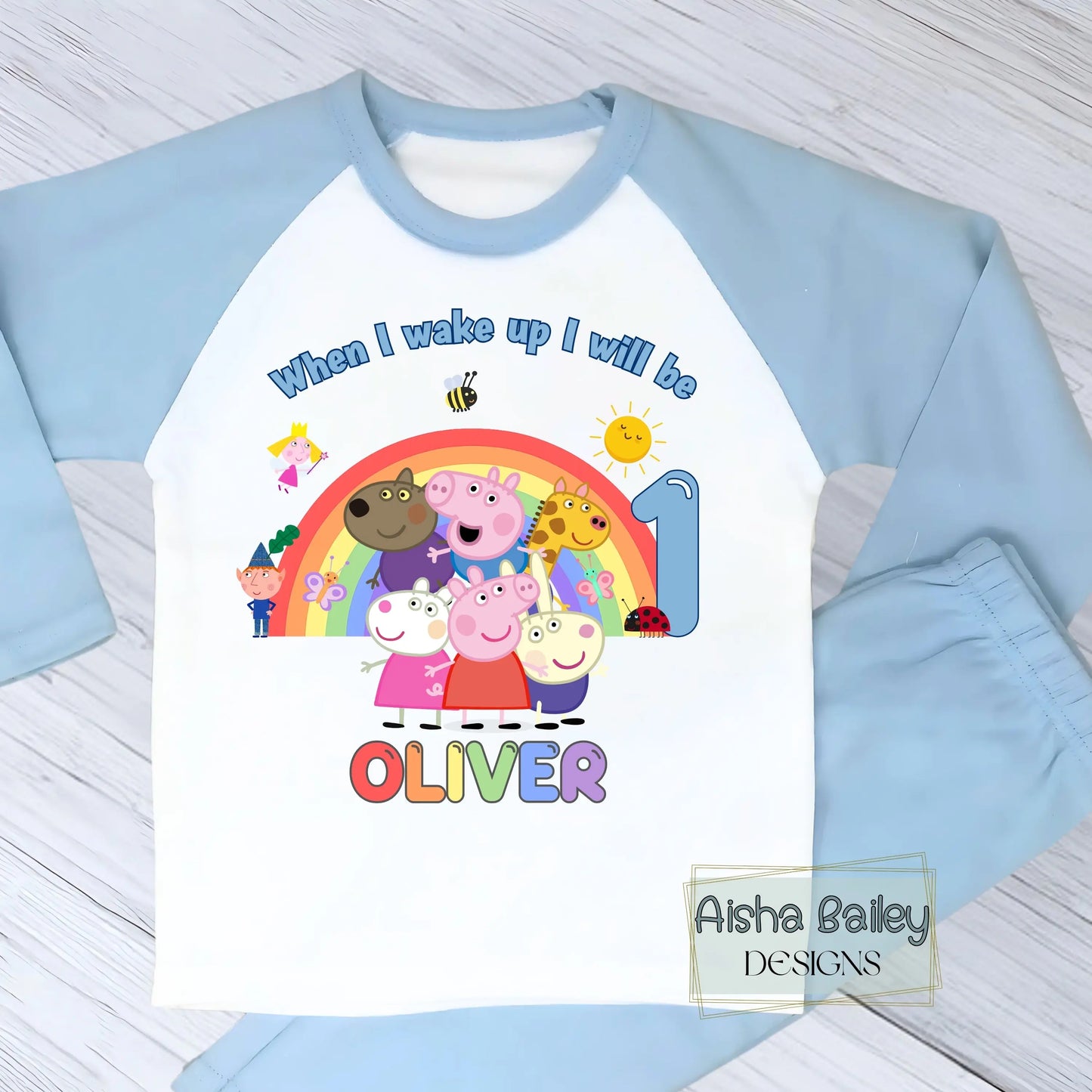 Blue Peppa Pig and friends personalised girls birthday pyjamas featuring a rainbow design and the text “When I wake up I will be with custom age and name, printed on a soft long-sleeve top and matching pink bottoms. Perfect personalised Peppa Pig birthday outfit for toddlers, ideal for first second third birthday celebrations, gifts, and bedtime photos.