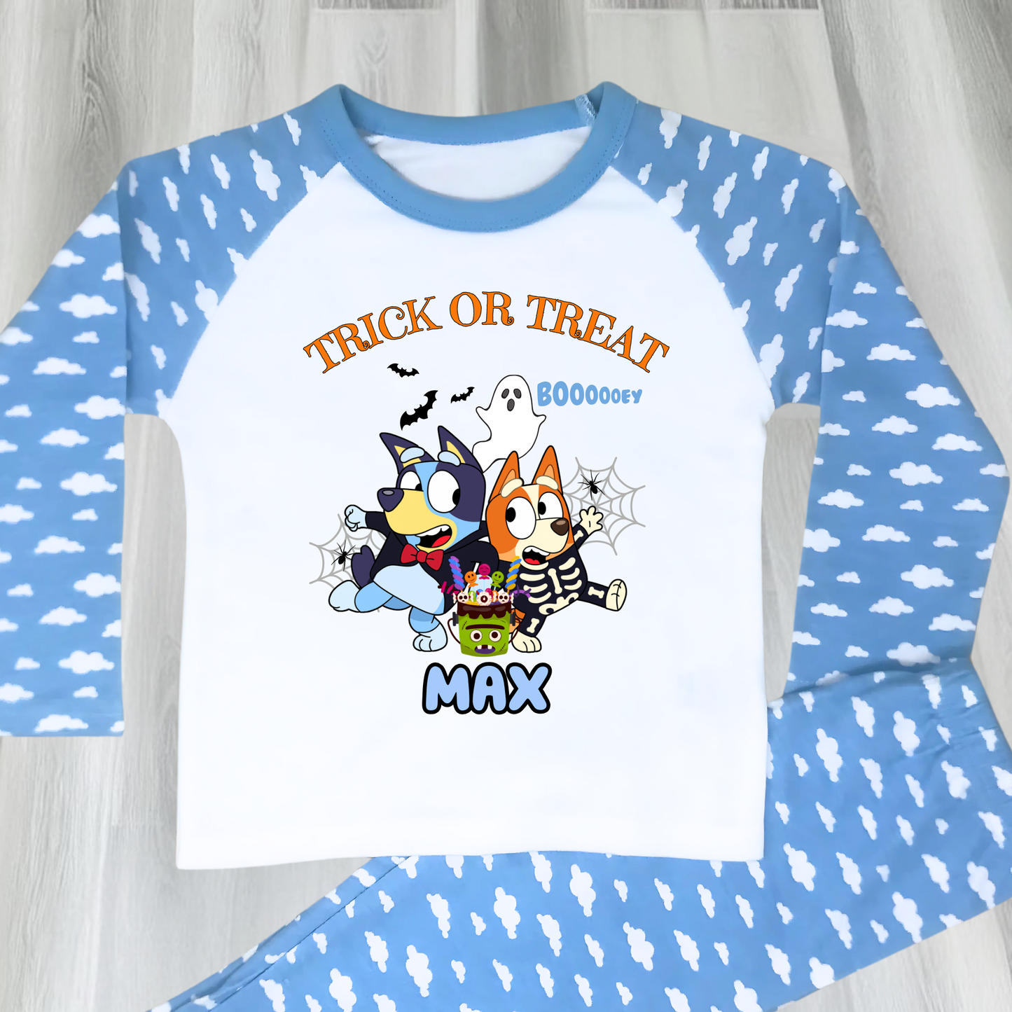 Boys personalised Bluey and Bingo Halloween pyjamas with name print and cute spooky design