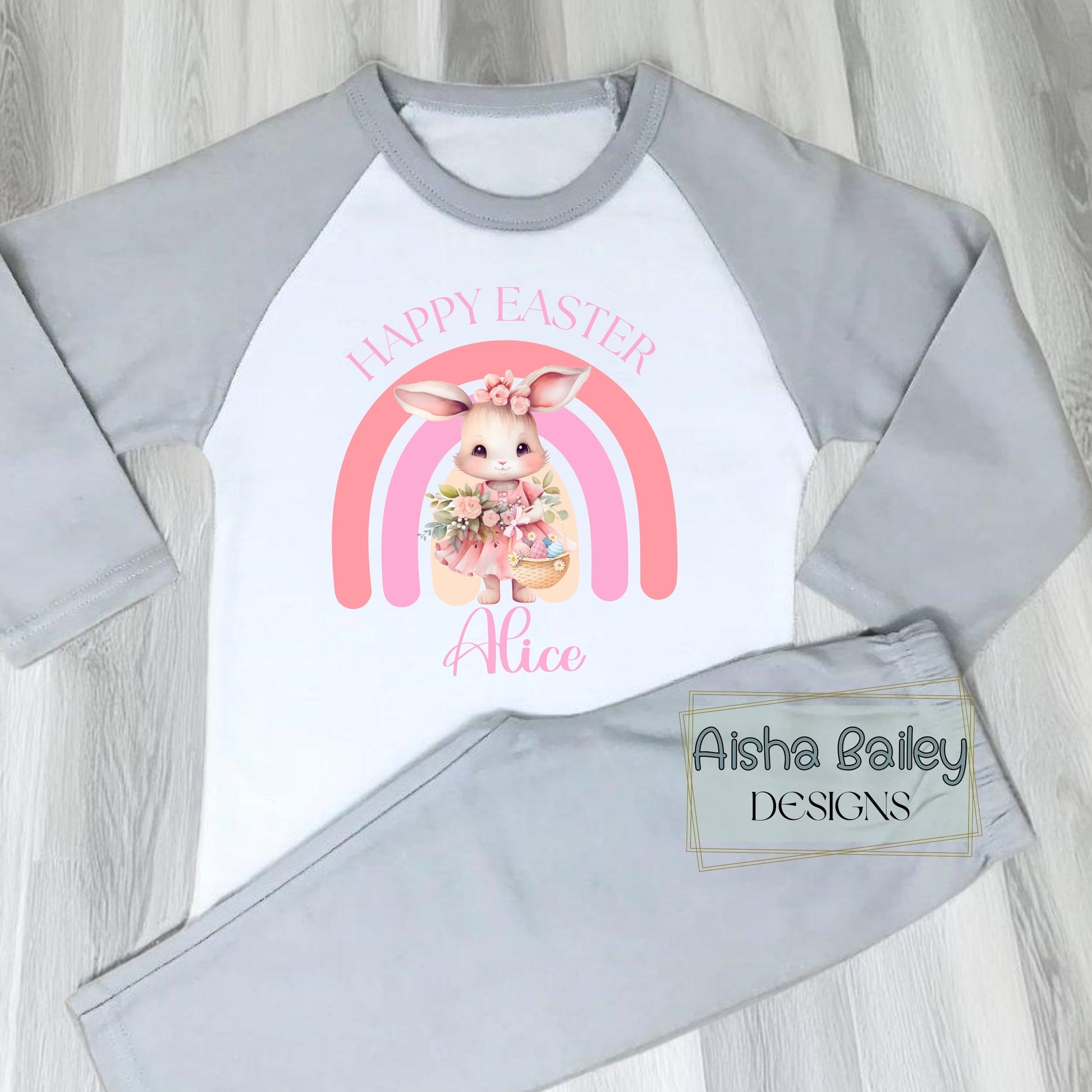 Personalised Easter Pyjamas for girls with their custom name. Bunny Rainbow design in soft pink pastel tones