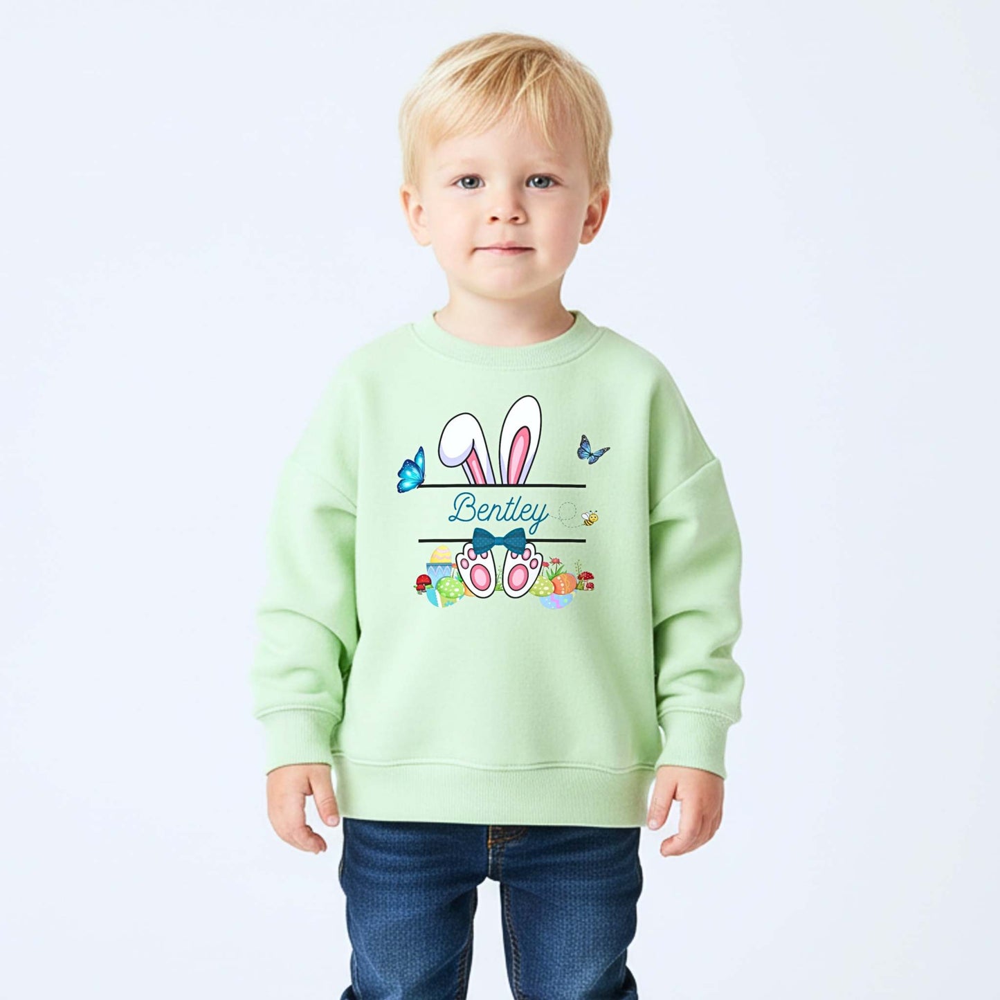 Boys Easter top with personalised split monogram bunny design, available as t-shirt or sweatshirt. Custom name Easter top
